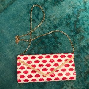 Aldo clutch with lips and gold chain